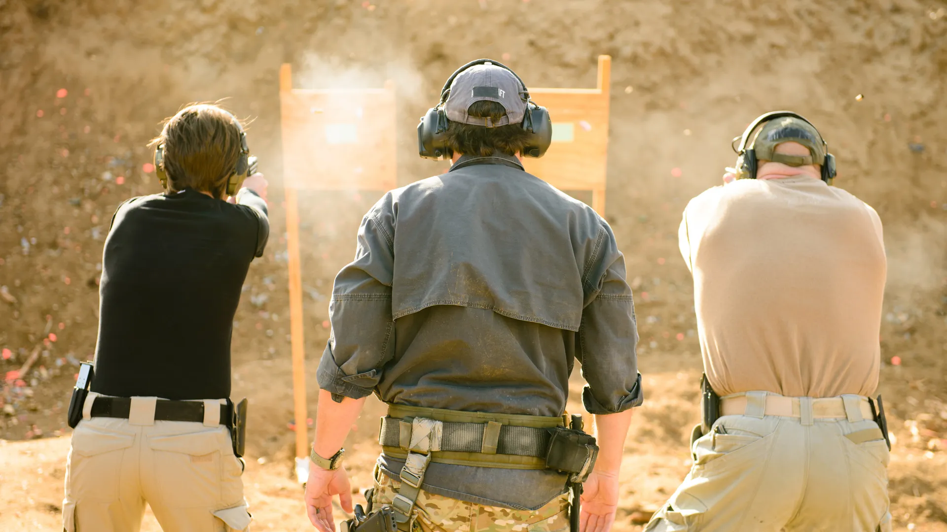 Shooters at the Aurora Gun Club firing line